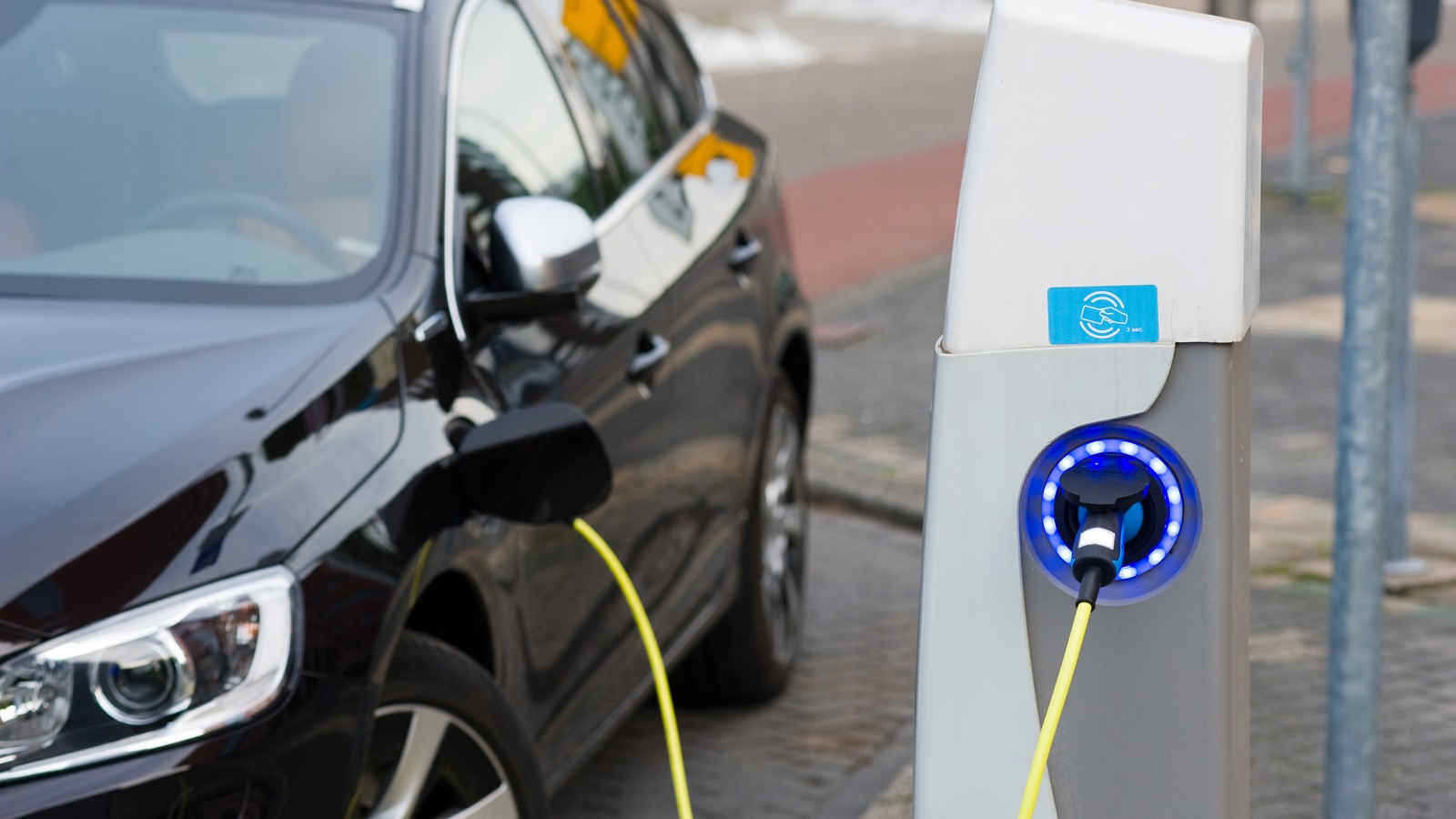 Electric car at charging station