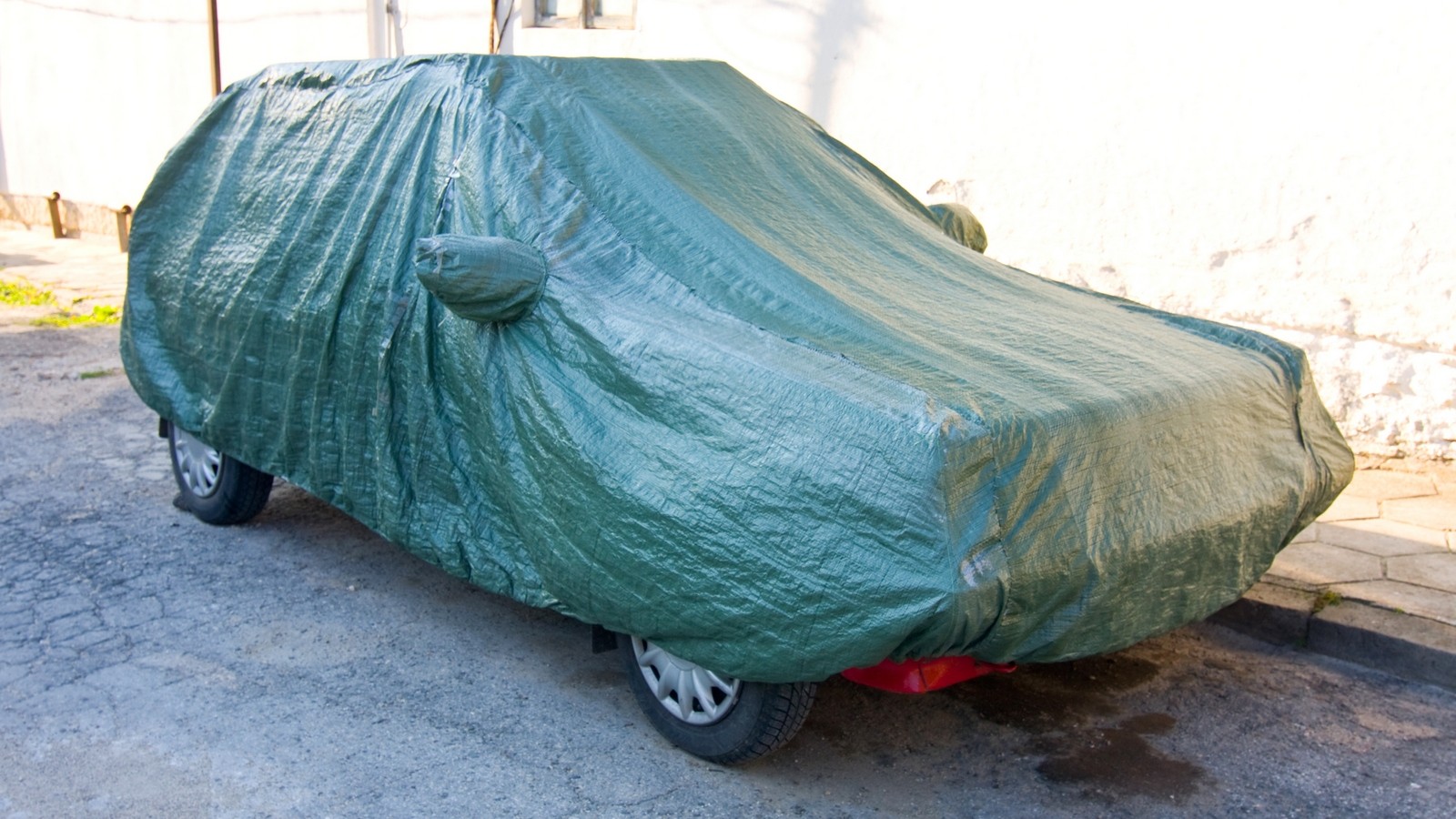 A parked car with protective cover
