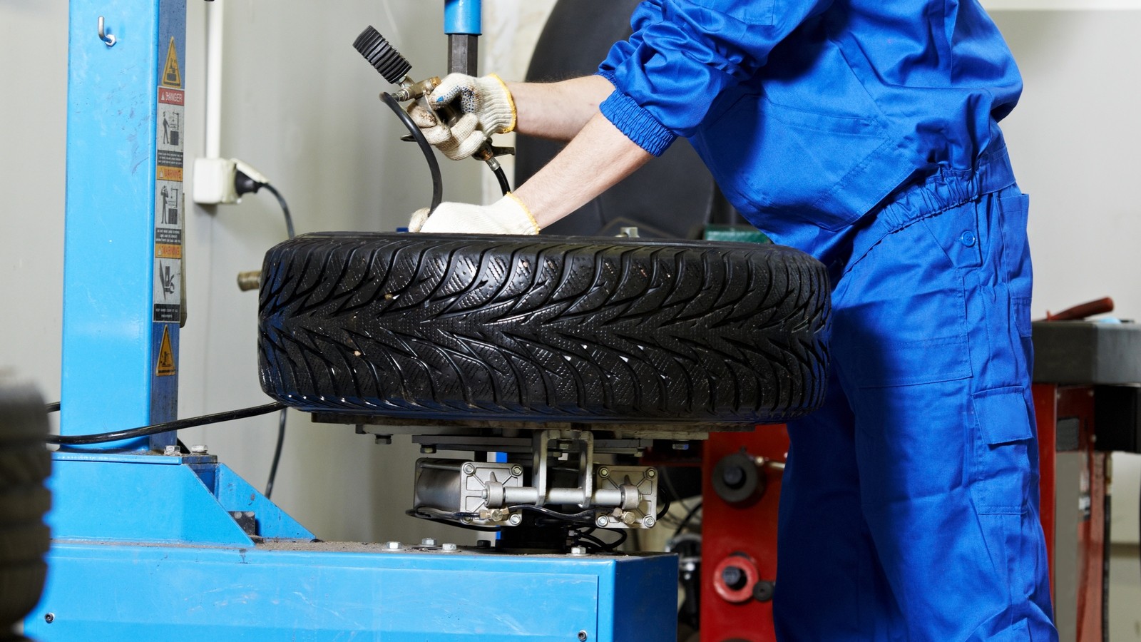 mechanic at auto wheel tyre changer