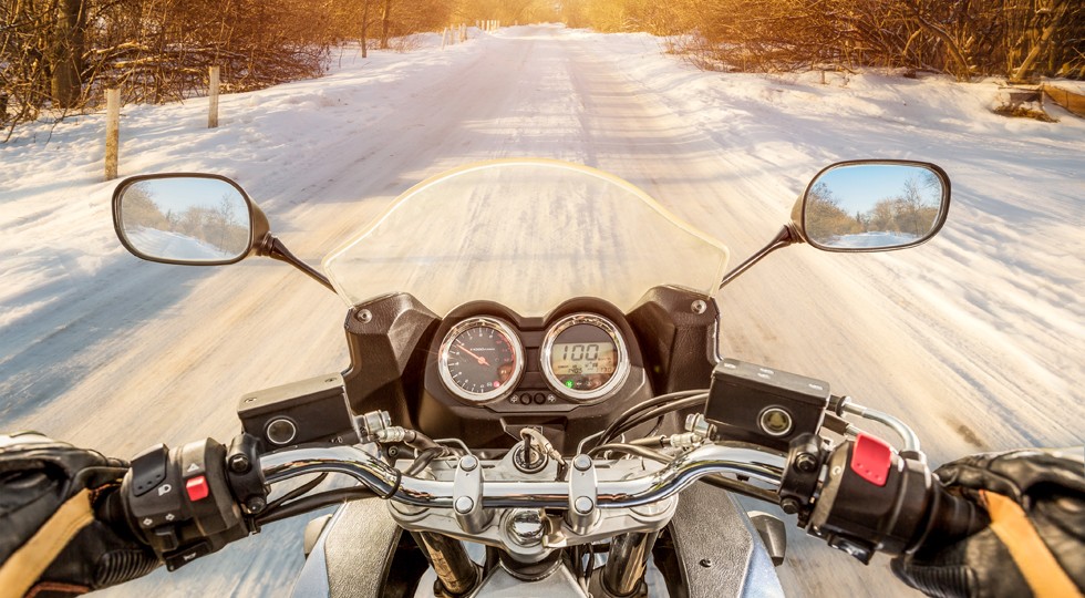 Biker First-person view. Winter slippery road
