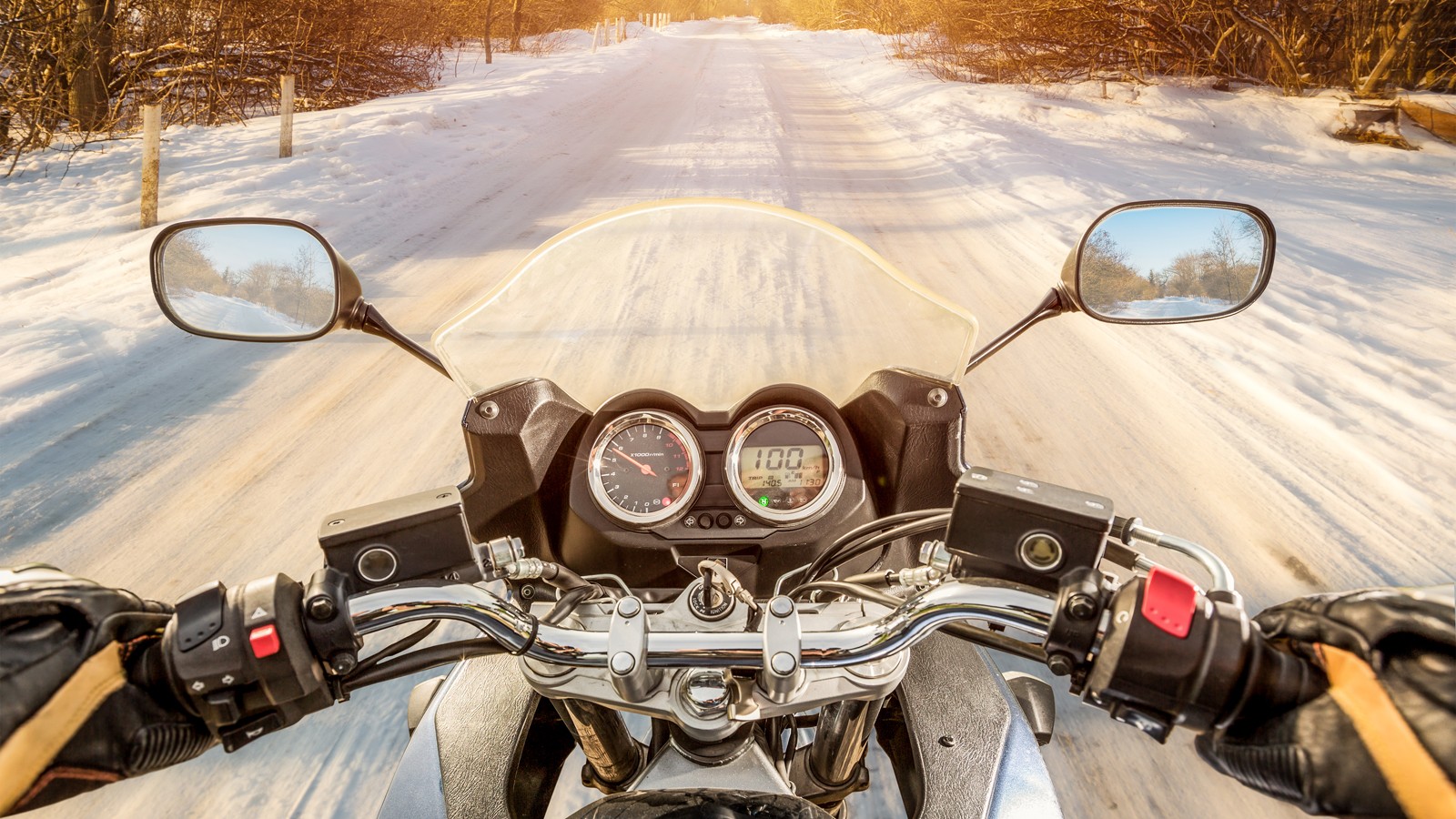 Biker First-person view. Winter slippery road