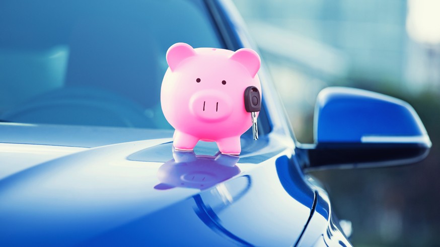 new car with piggy bank, key on hood