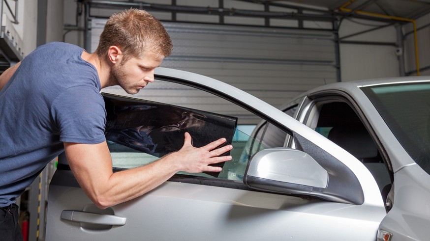 Applying tinting foil onto a car window