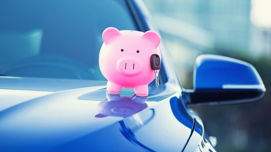 new car with piggy bank, key on hood