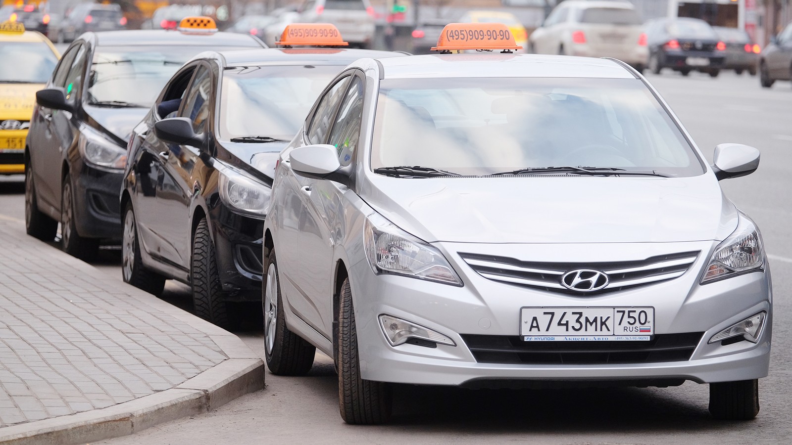 Taxis waits for passengers. Taxi cars on the street of Moscow
