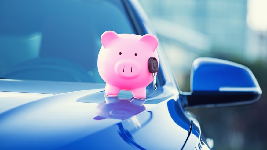 new car with piggy bank, key on hood
