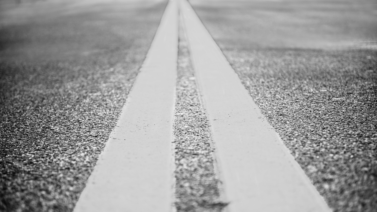 Asphalt highway with yellow markings lines on road background