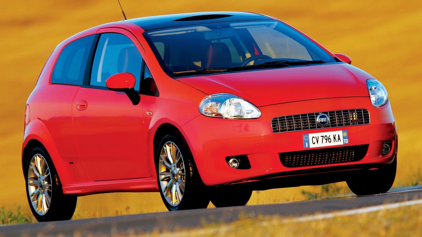 На фото: Fiat Grande Punto 3-porte '2005–12