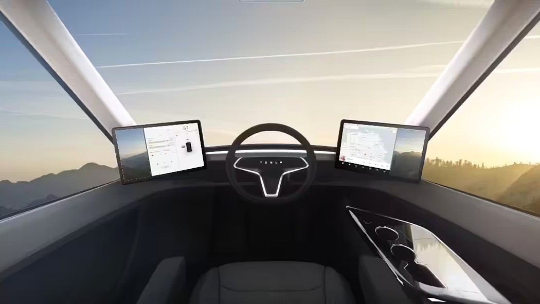 В кабине Tesla Semi место водителя располагается по центру, роль наружных зеркал выполняют камеры, в оснащении заявлен автопилот.