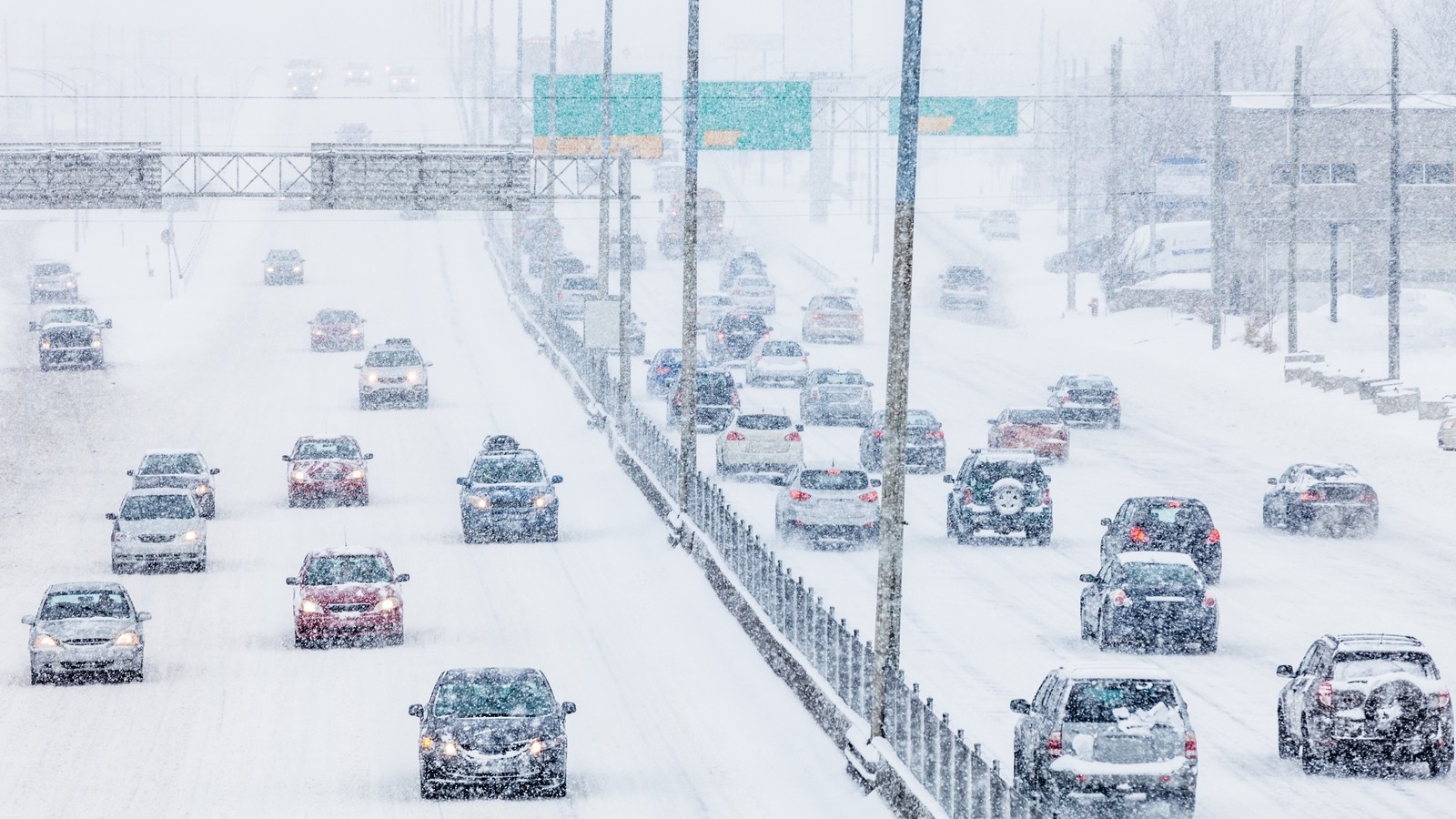 Snowstorm on the Highway during the Rush Hour