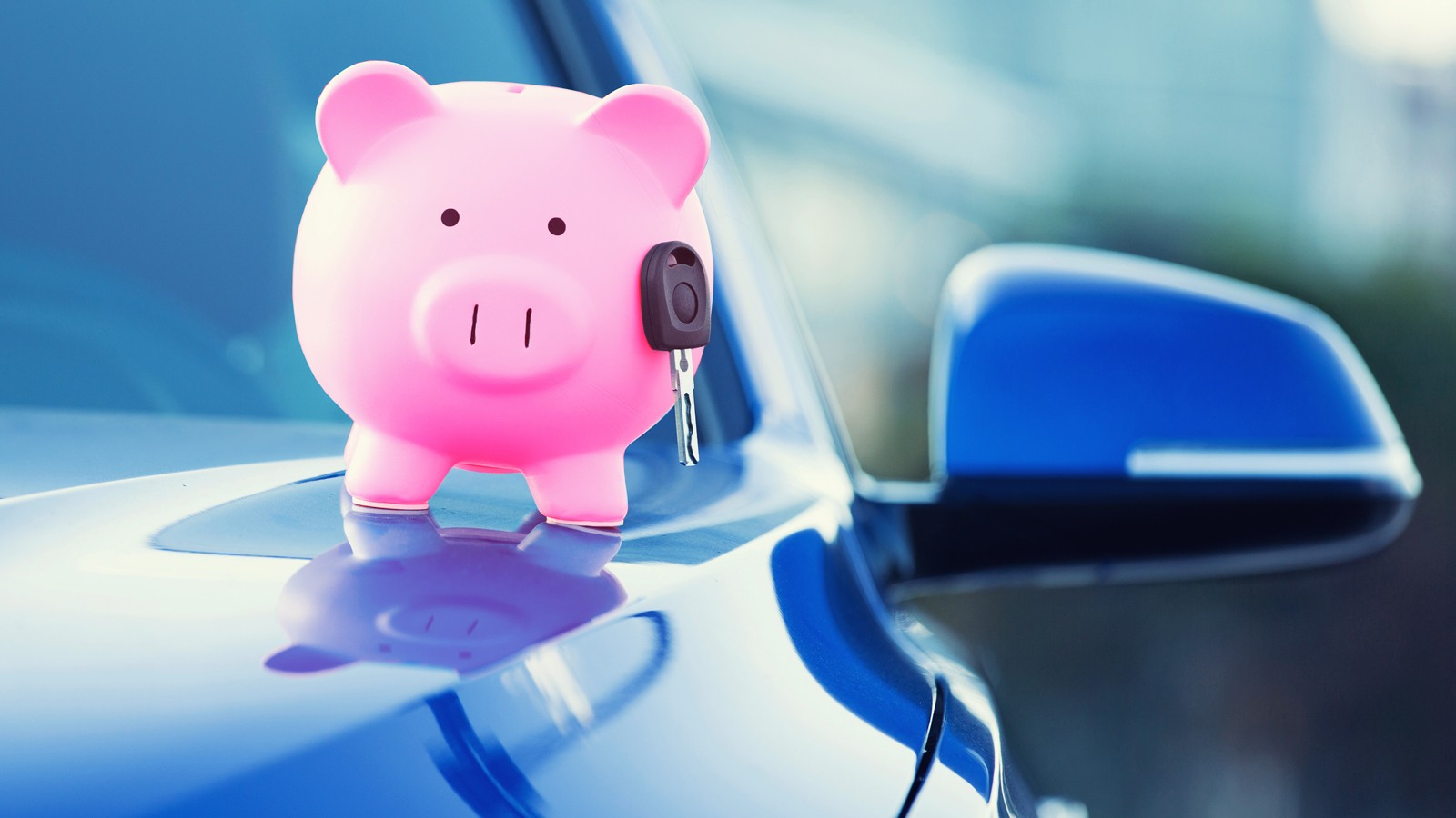 new car with piggy bank, key on hood
