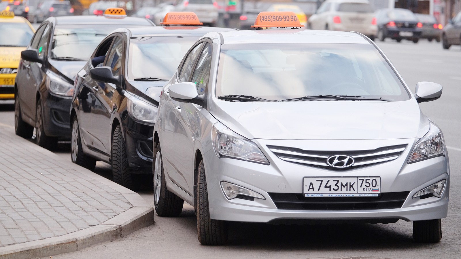 Taxis waits for passengers. Taxi cars on the street of Moscow