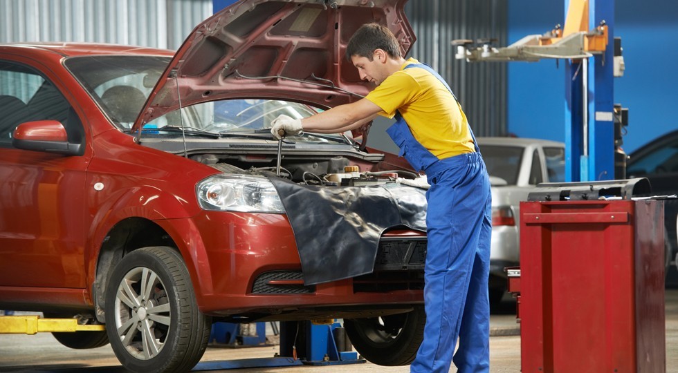auto mechanic at work with wrench