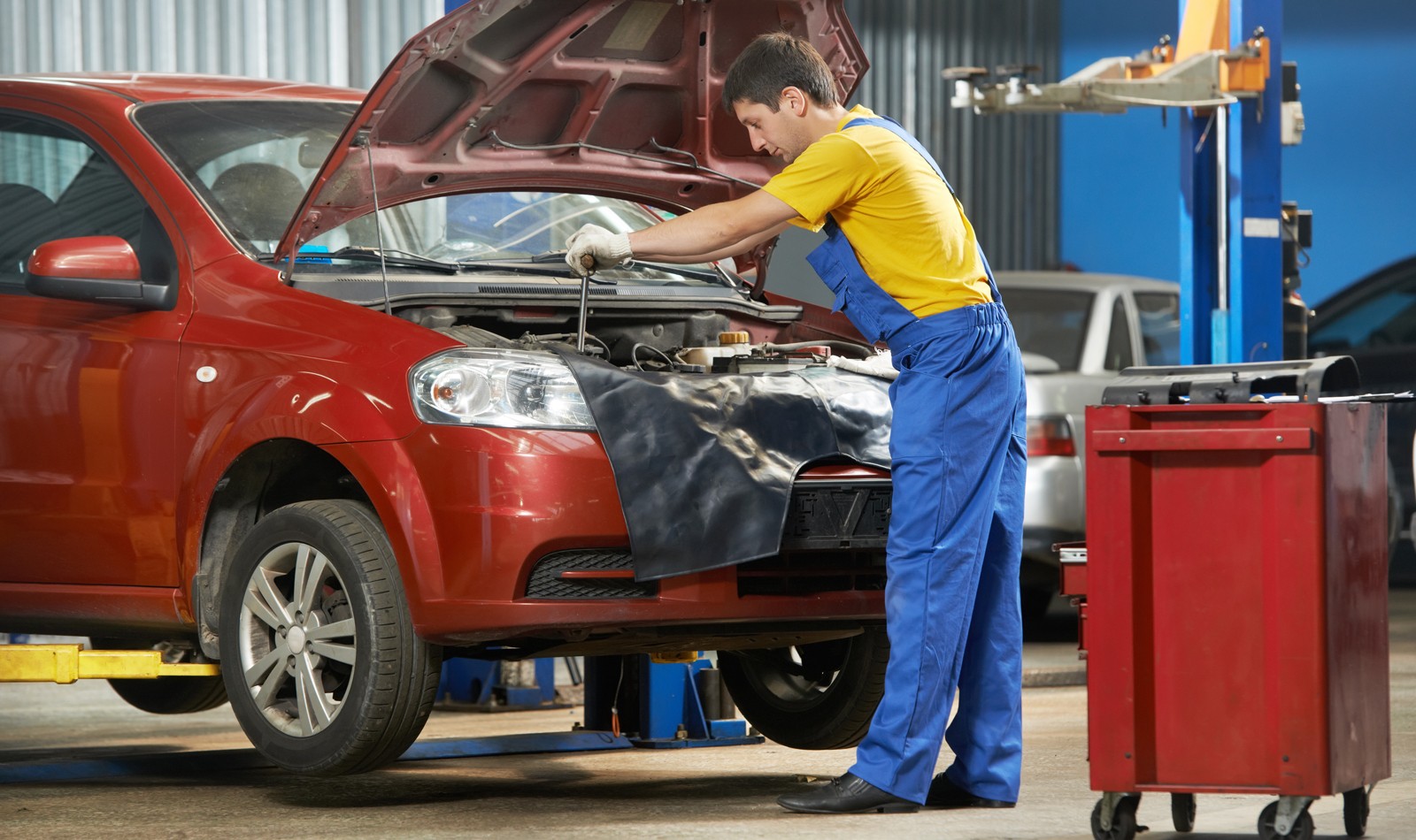 auto mechanic at work with wrench
