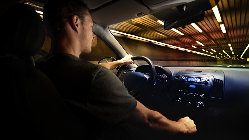 Young Adult Driving Over the Speed Limit in a Tunnel.