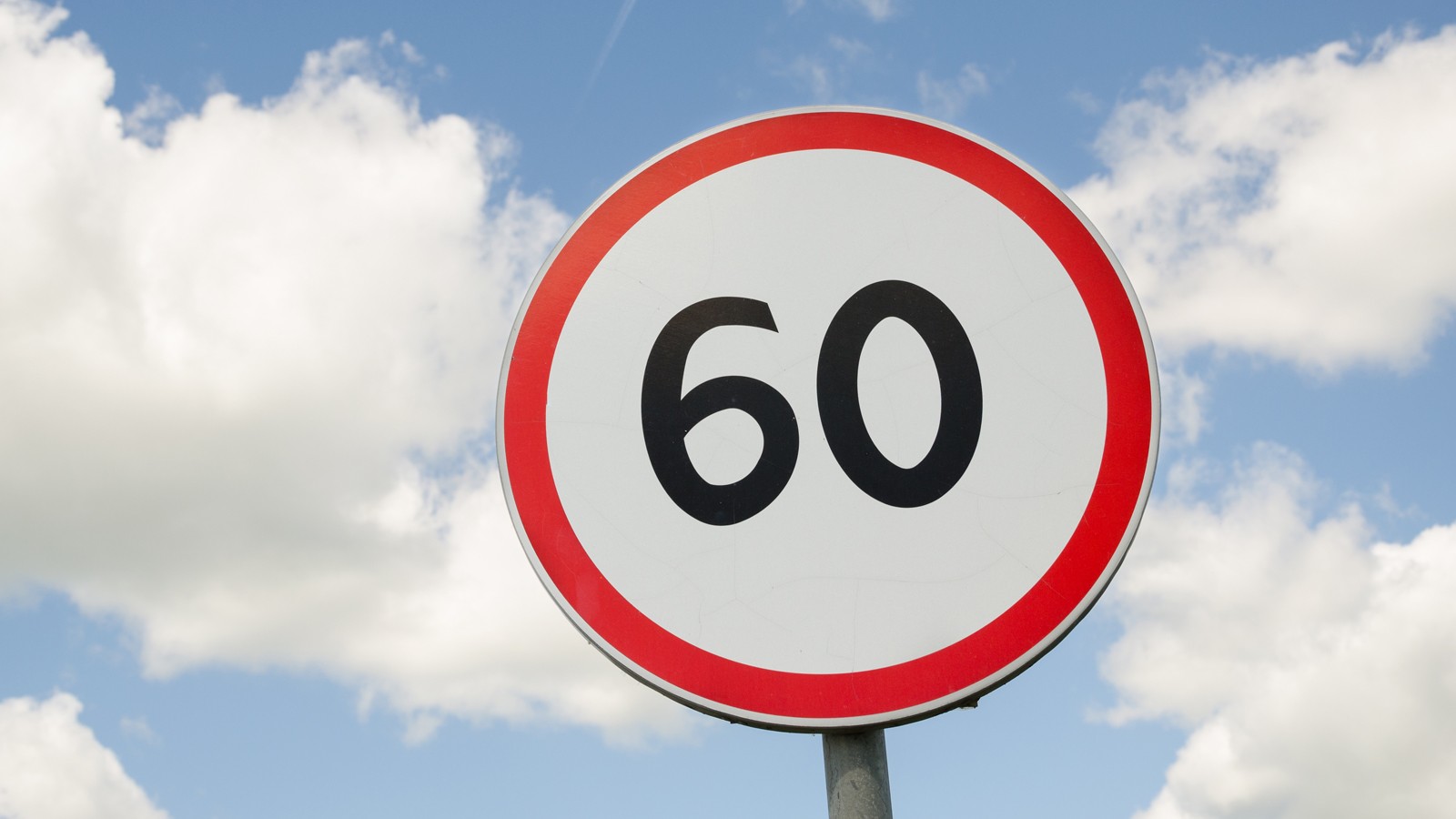 road traffic round sign limiting speed on blue sky