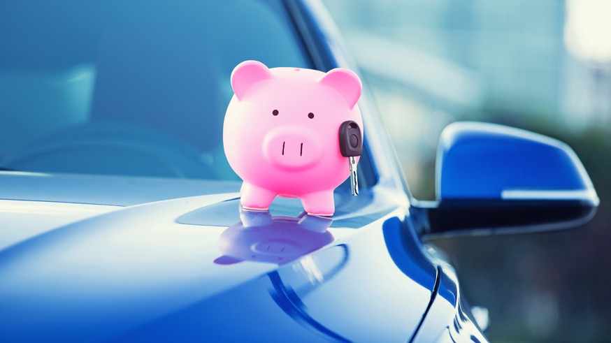 new car with piggy bank, key on hood