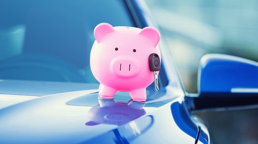 new car with piggy bank, key on hood