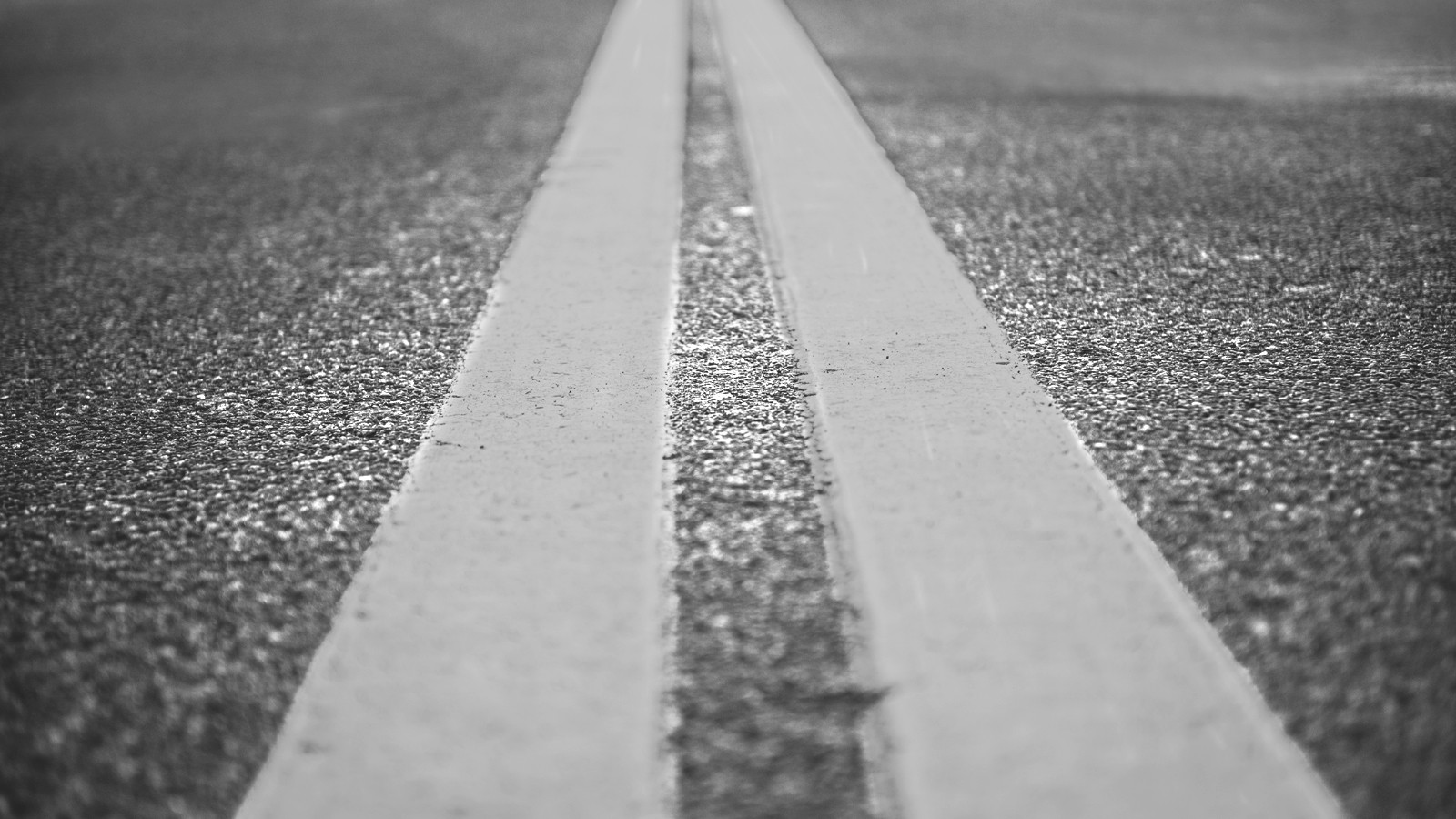 Asphalt highway with yellow markings lines on road background
