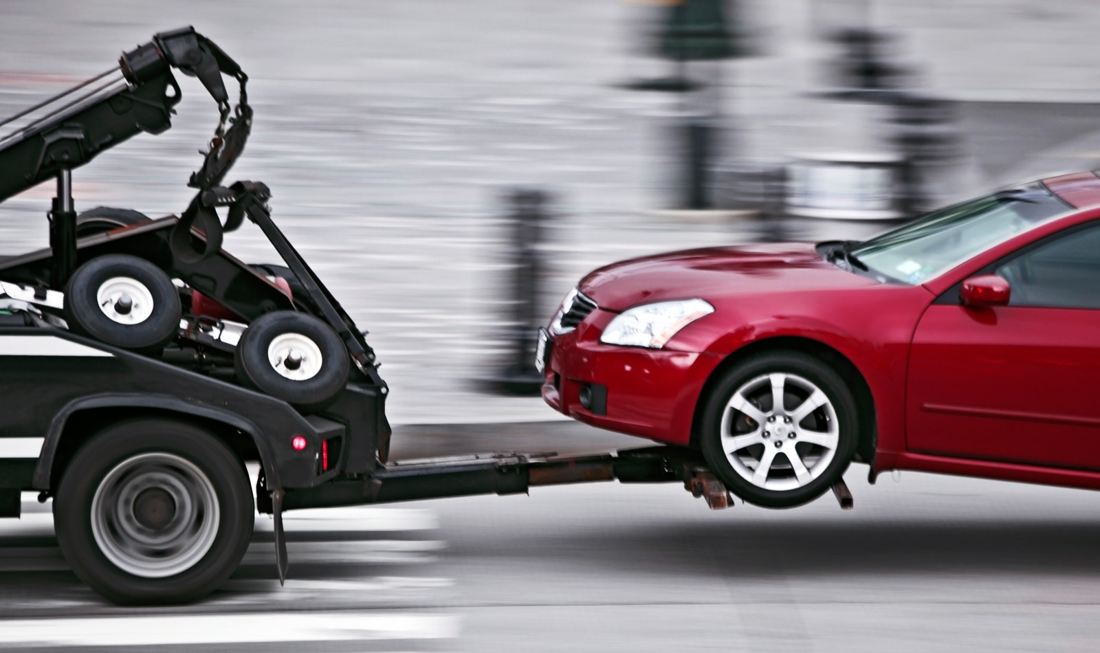 tow truck delivers the damaged vehicle