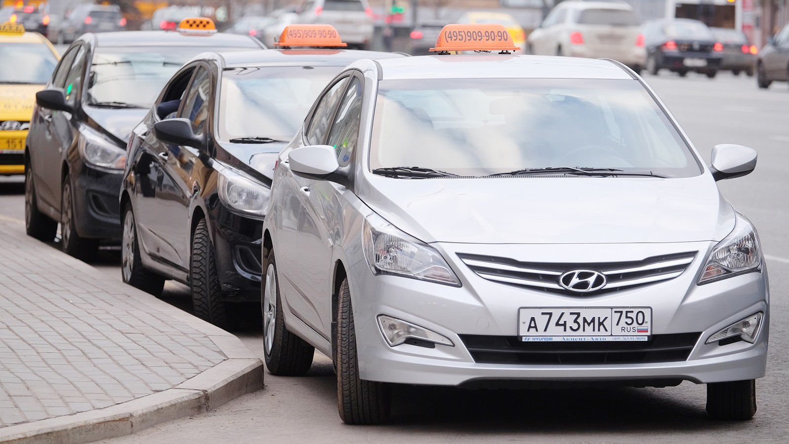 Taxis waits for passengers. Taxi cars on the street of Moscow