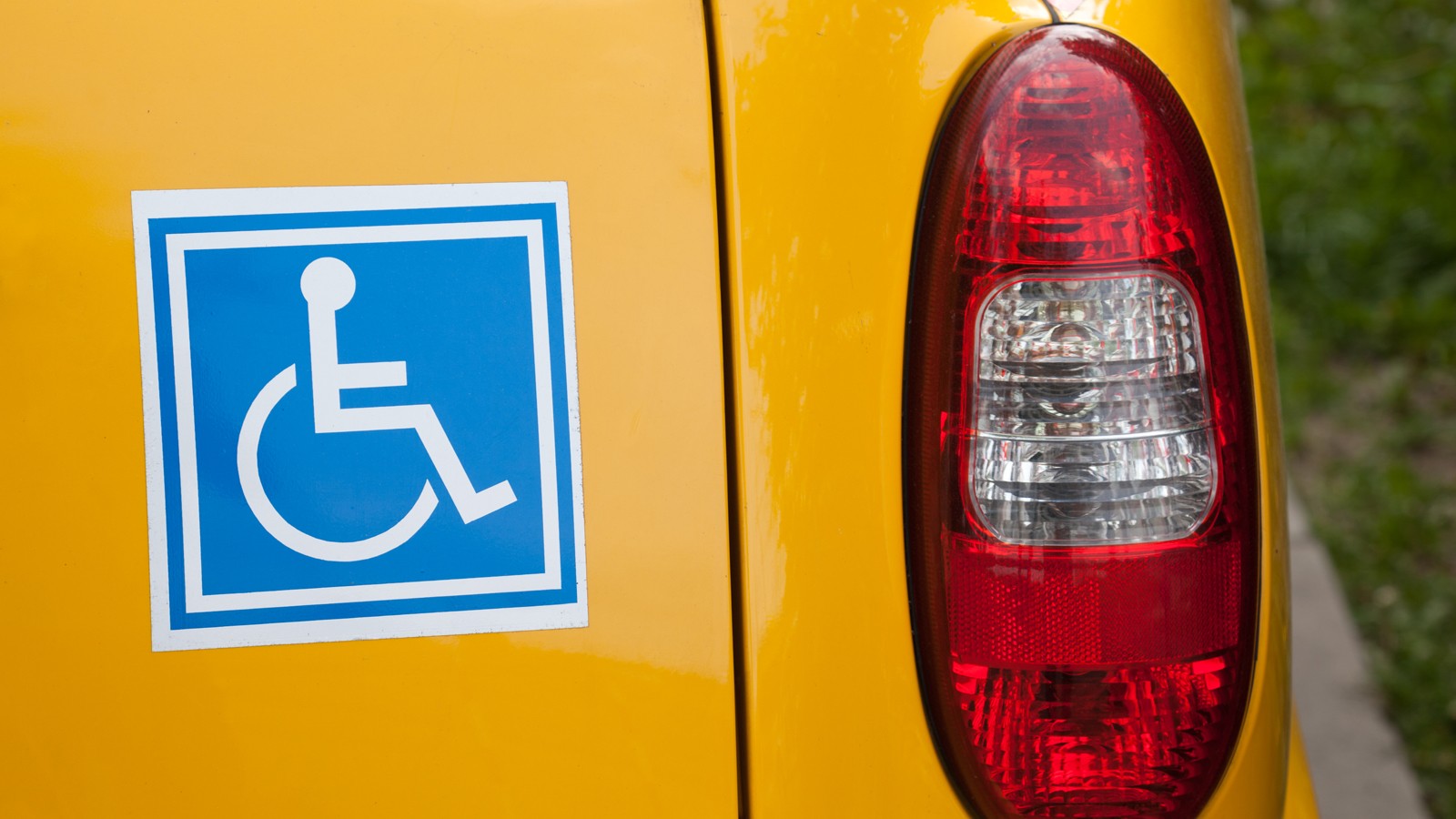 Handicapped sign on back of car