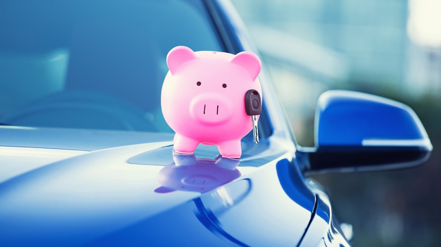 new car with piggy bank, key on hood