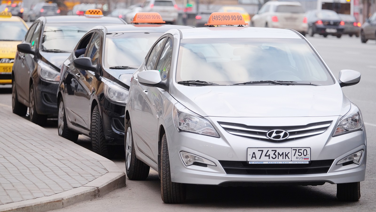 Taxis waits for passengers. Taxi cars on the street of Moscow