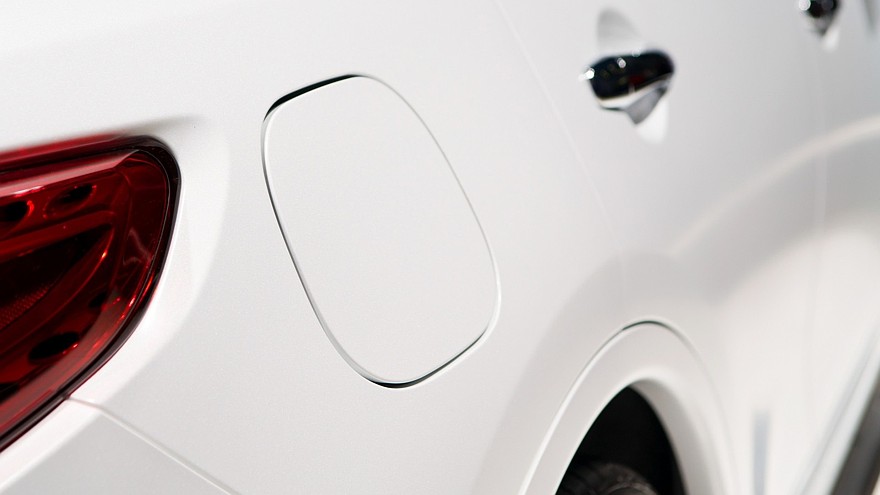A close up of a petrol cap cover on a modern car