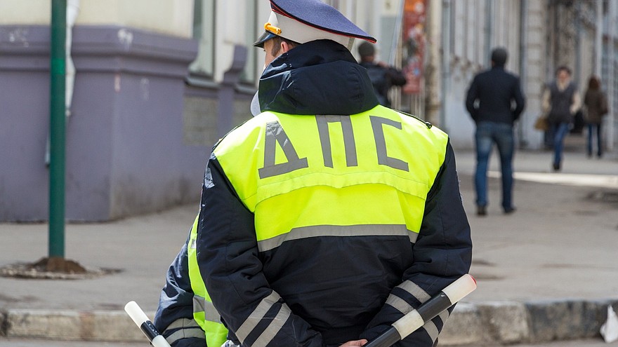 Russian police officers standing by the road in lime-colored uniform