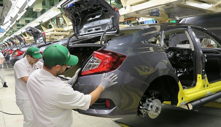 Honda of Canada Mfg. associates install a rear bumper