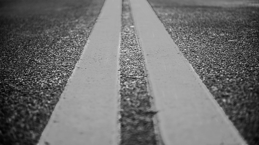 Asphalt highway with yellow markings lines on road background