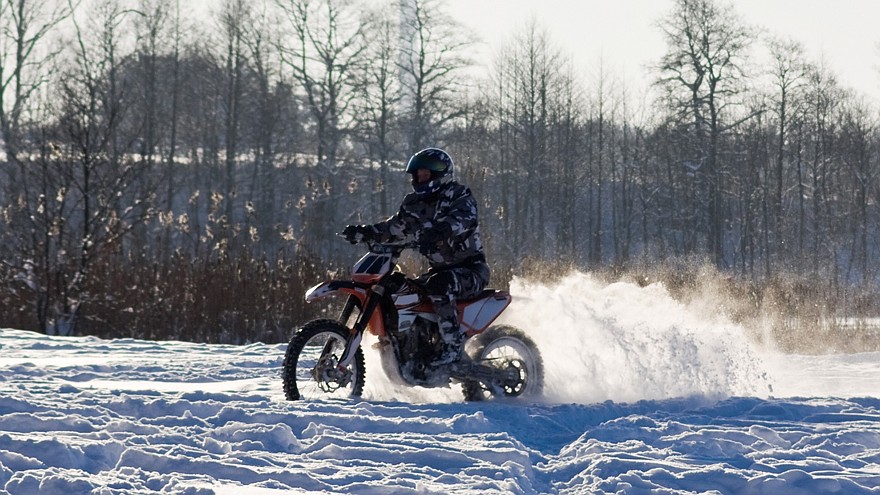 race on a motorcycle in the winter