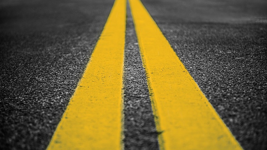 Asphalt highway with yellow markings lines on road background
