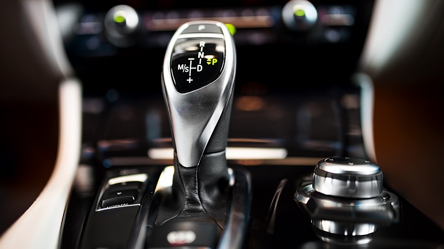 Detail of an automatic gear shifter in a new, modern car. Modern