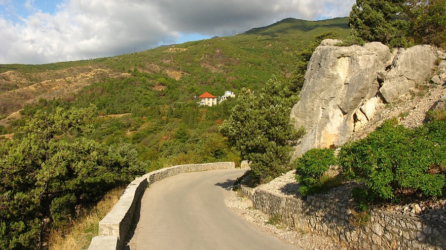 Mountainous landscape with serpentinous road.