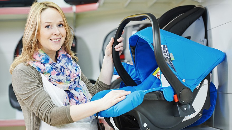 woman choosing child car seat