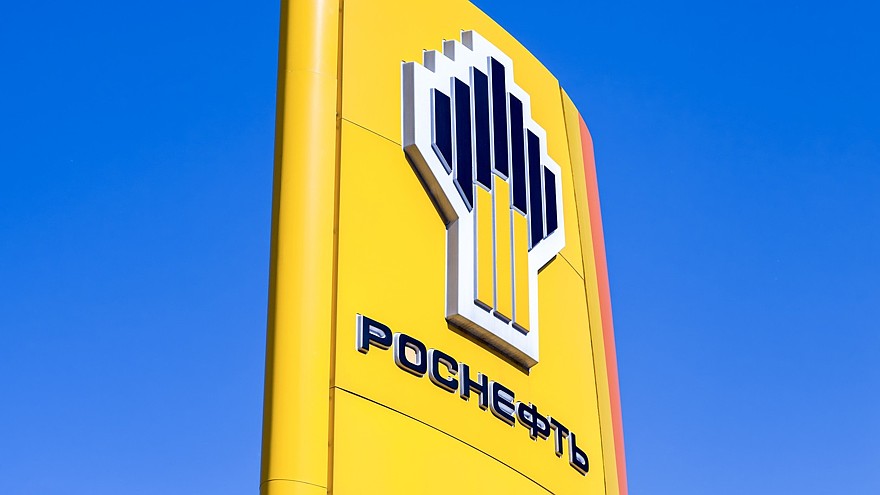 The emblem of the oil company Rosneft against the blue sky background